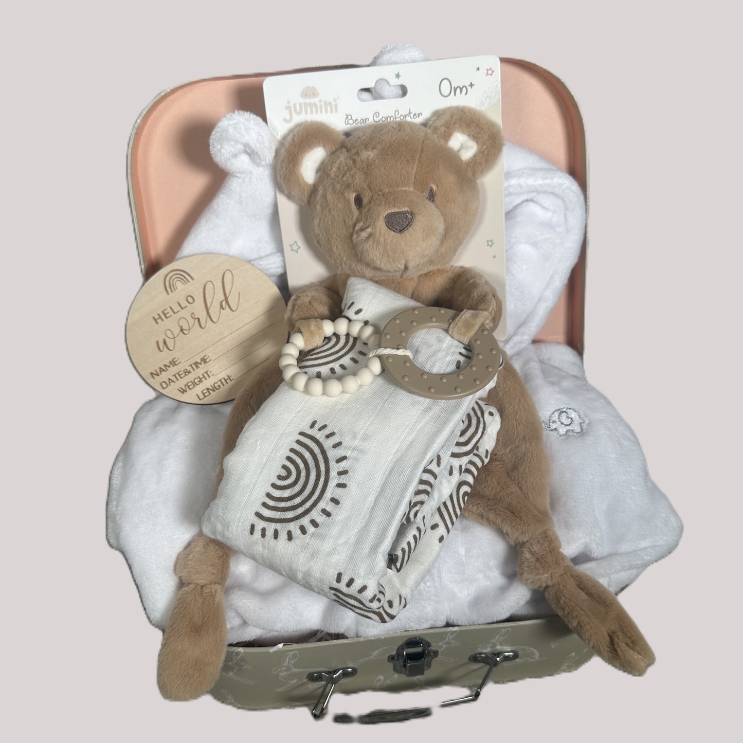 Baby gift set with teddy bear baby teether/comforter, baby dressing gown, and muslin in a baby keepsake case on a light pink background