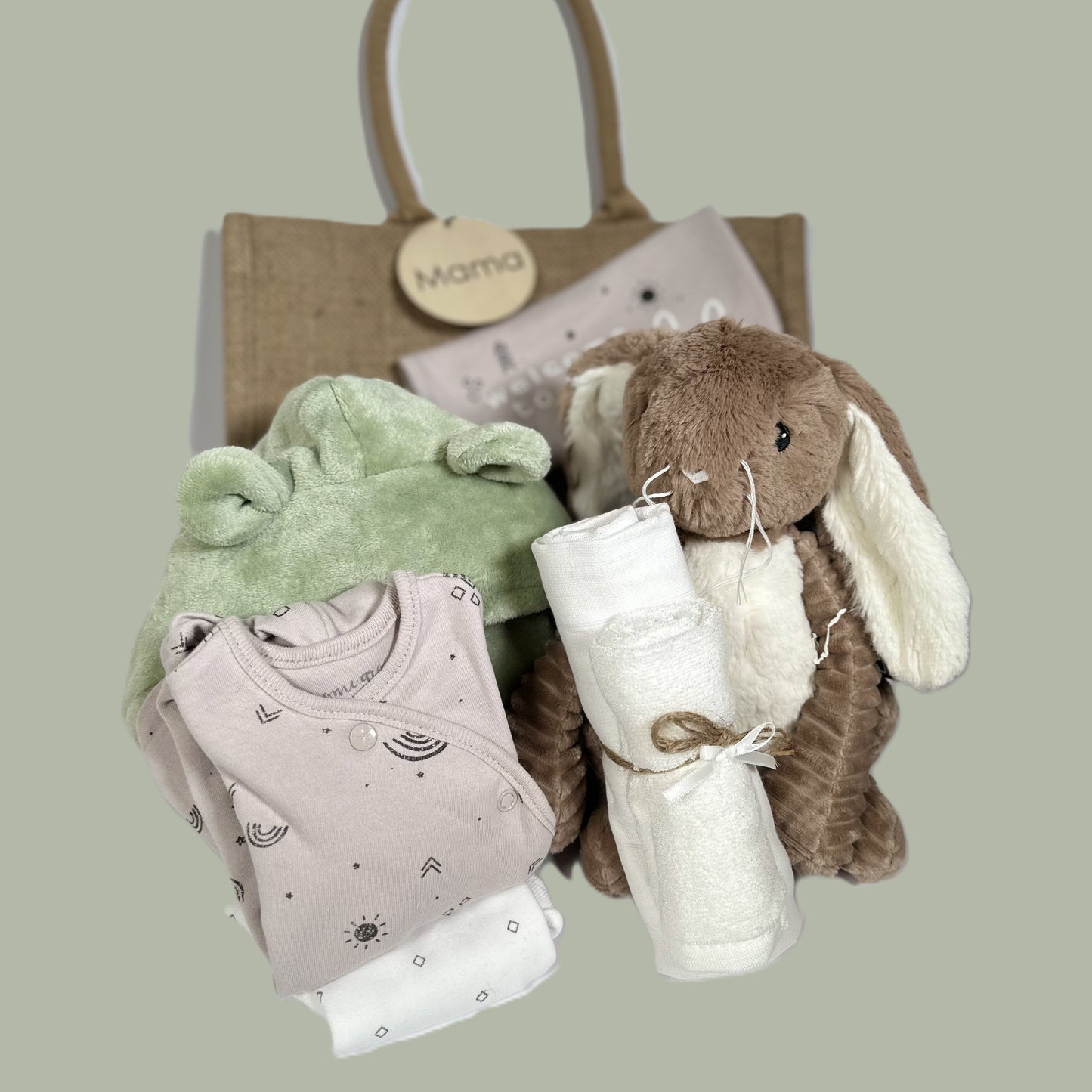 unisex new baby gift with organic cotton babywear, a baby dressing gown and soft bunny toy