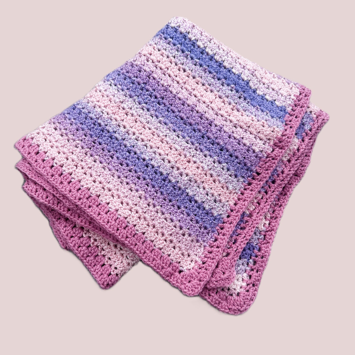 Crocheted baby blanket pinks and purples