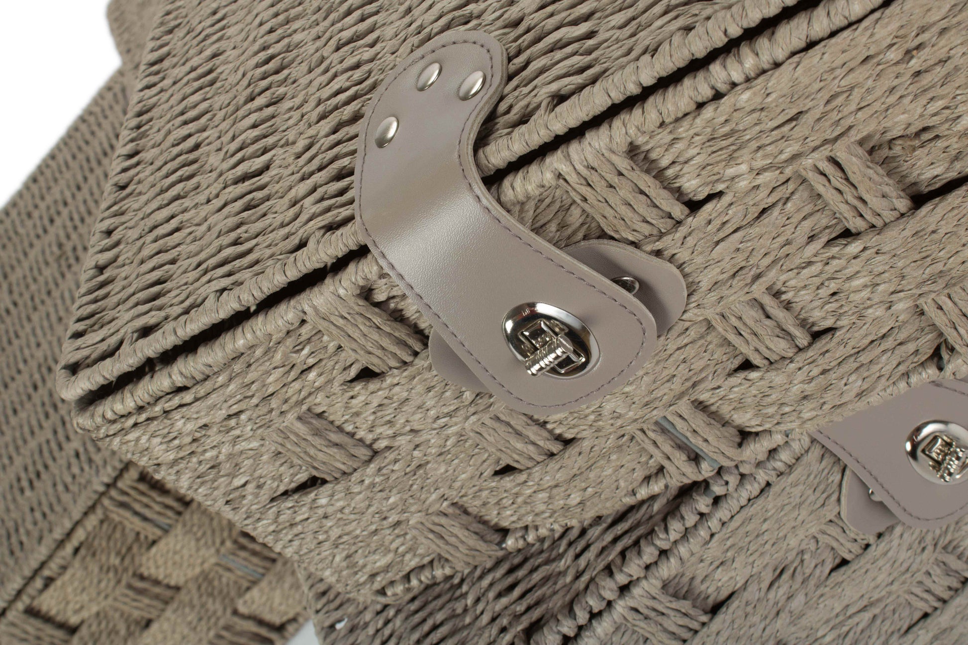 Close-up of a grey paper rope hamper with a metallic clasp.