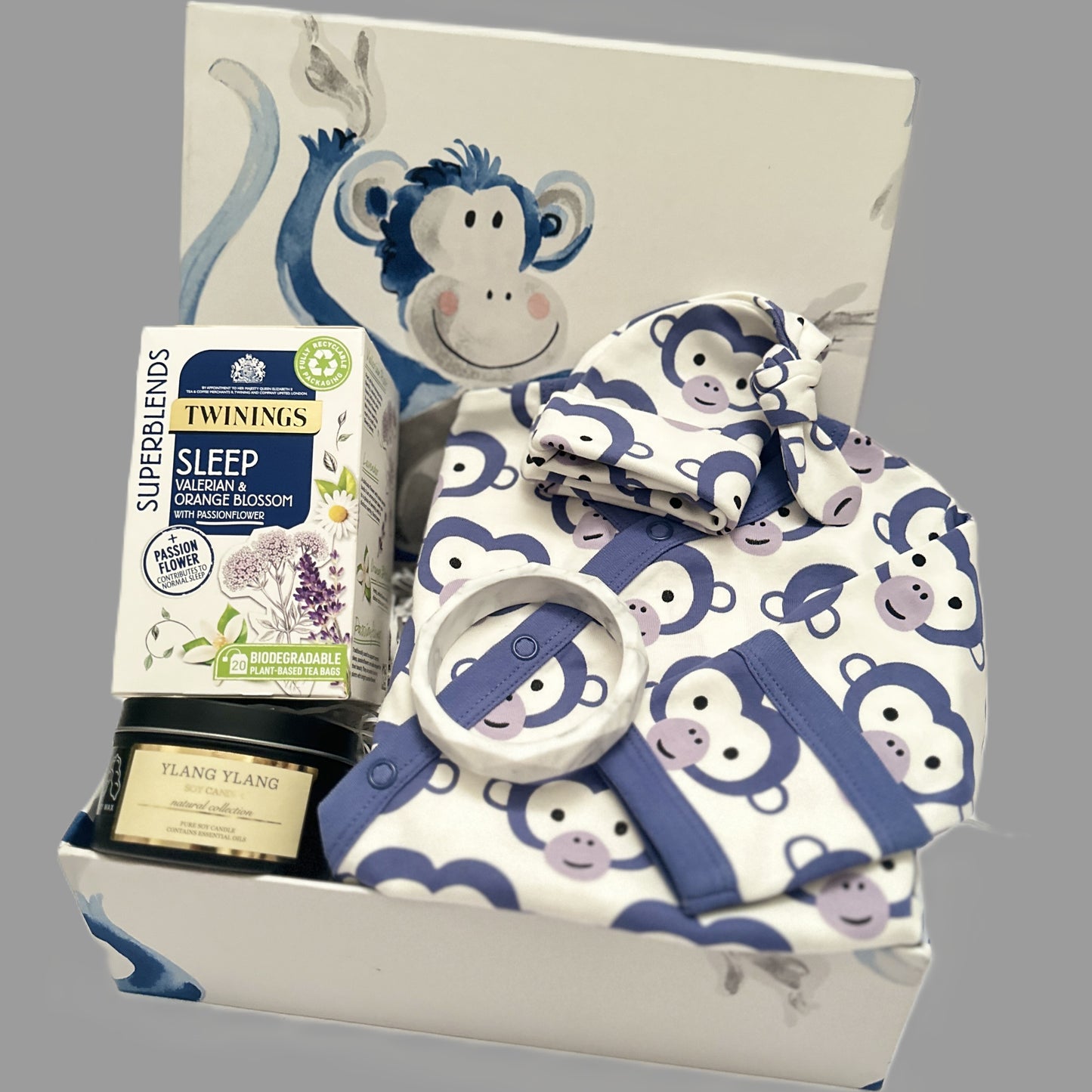 Fabulous new baby gift hamper with a handcrafted baby keepsake box with monkey print, organic cotton GOTS certified monkey print baby romper and matching baby knot hat and treats for the new mummy.