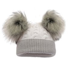 Knitted baby hat with two large pom-poms on a white background