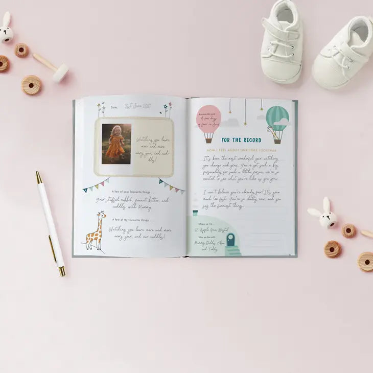 A hardback new baby journal, The Story of Us - a journey through childhood