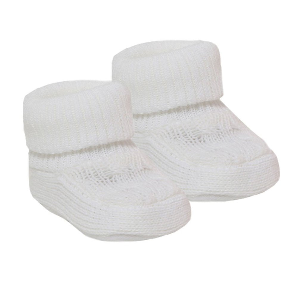 Pair of white knitted baby booties on a white background