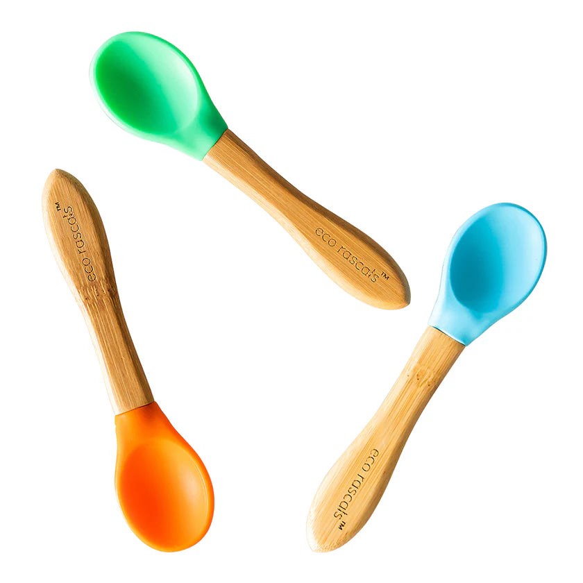 Three colourful spoons with bamboo handles and silicone ends on a white background
