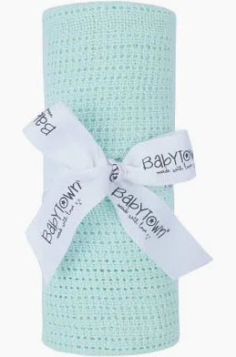 Mint coloured baby blanket with white ribbon and 'Baby Town' label on a white background