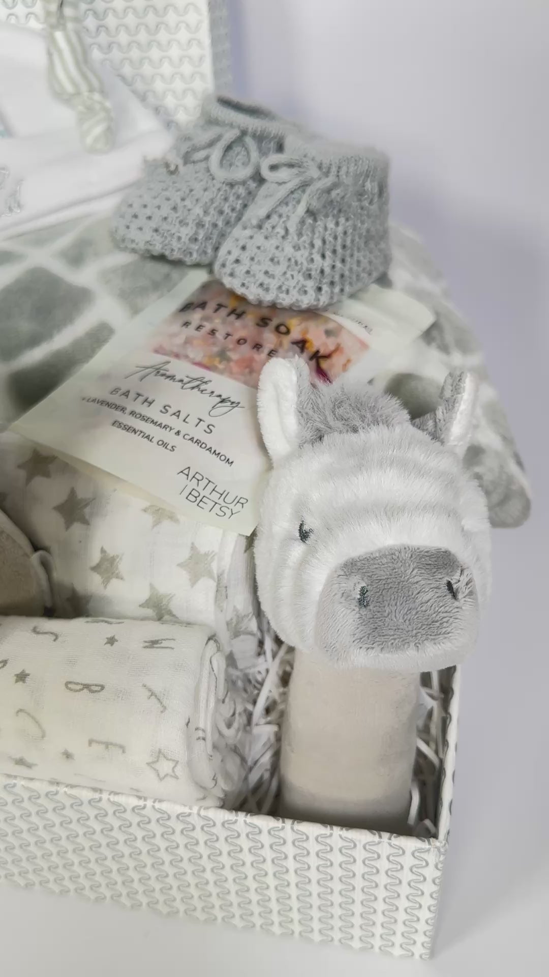 video of a unisex new baby gift with a zebra theme.