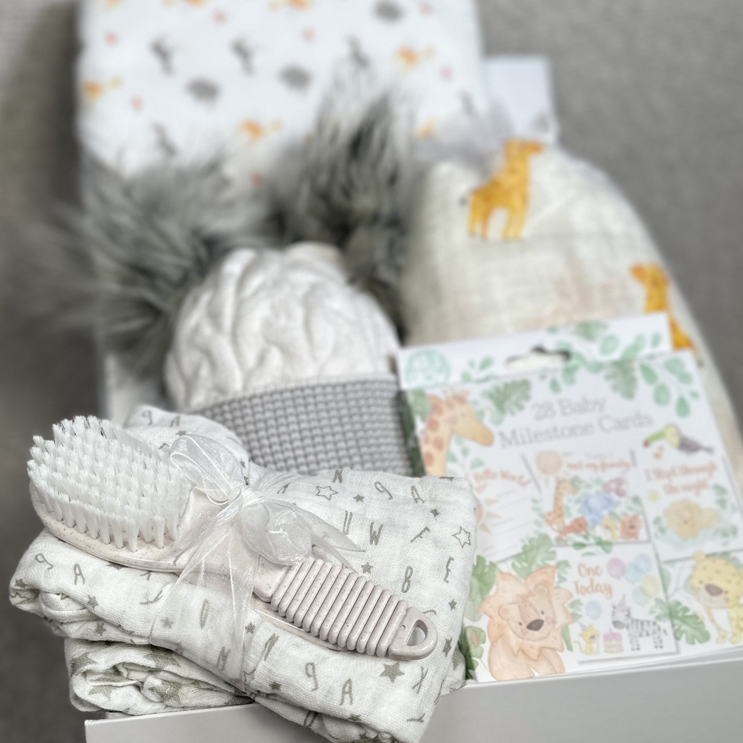 new baby gift set with muslins baby hat and hooded bath towel.