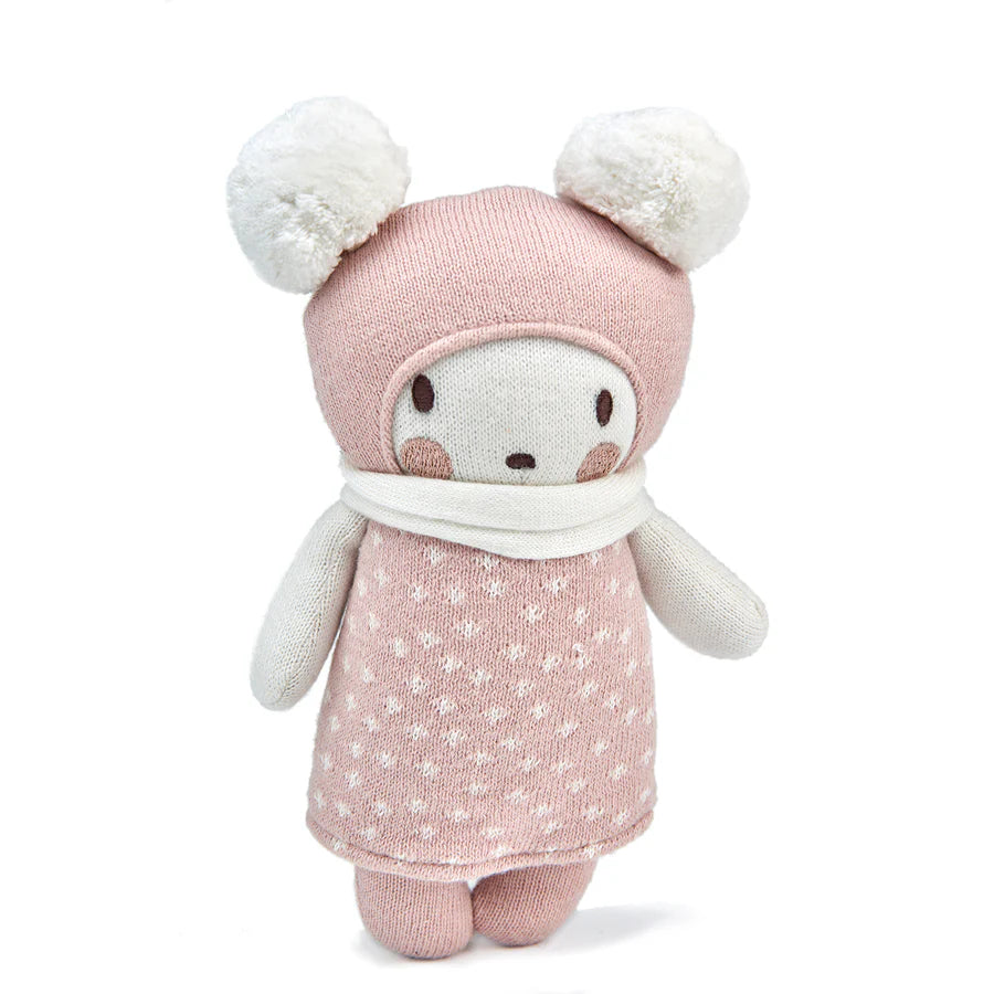 Bella knitted doll with pink outfit and white pom-poms on a white background