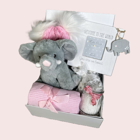 pink baby girl hamper with elephant soft toy and baby photo frame
