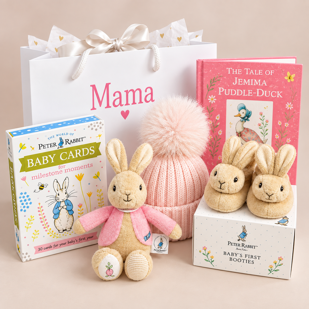 Baby girl hamper with flopsey bunny baby rattle, bunny slippers, pink pompom hat and Peter Rabbit baby milestone cards