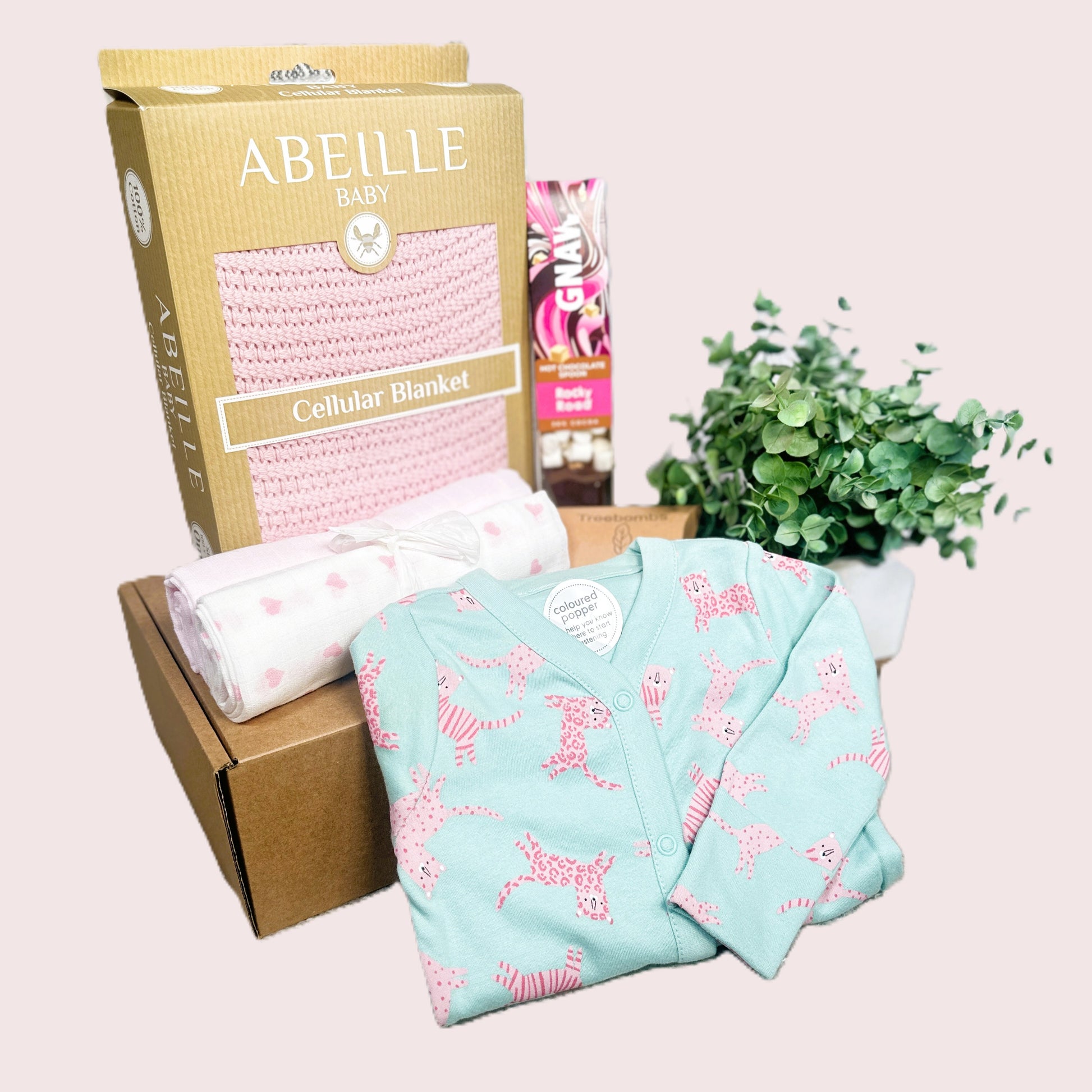 Baby girl hamper gift with pink blanket and sleepsuit with tiger print