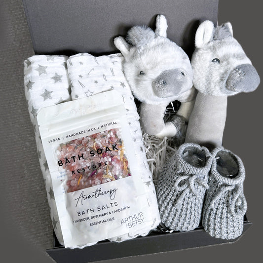 Baby gift set with, bath salts, and plush zebra baby rattles and muslins in a box.