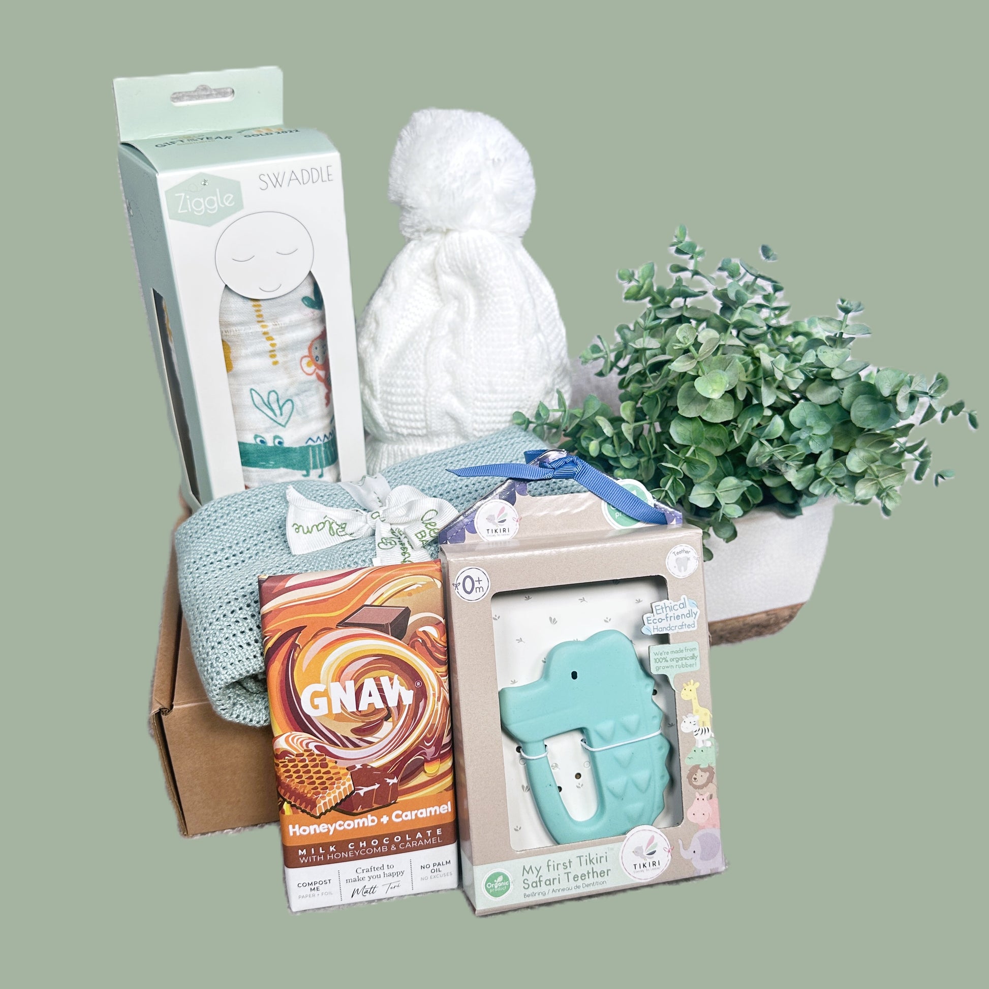 Baby shower gift with a bamboo baby blanket , a large swaddle, a baby hat and a crocodile natural rubber baby teether