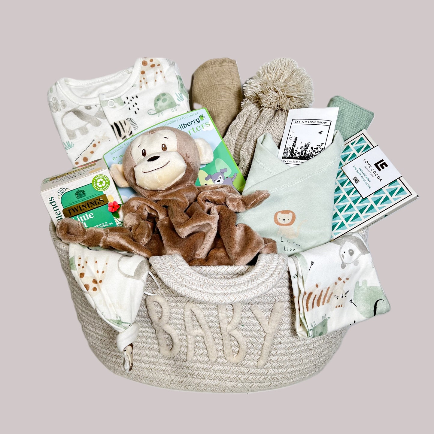 Baby shower gifts - monkey themed with a cotton layette set, a monket baby comfoter and a cotton rope nappy changing basket.