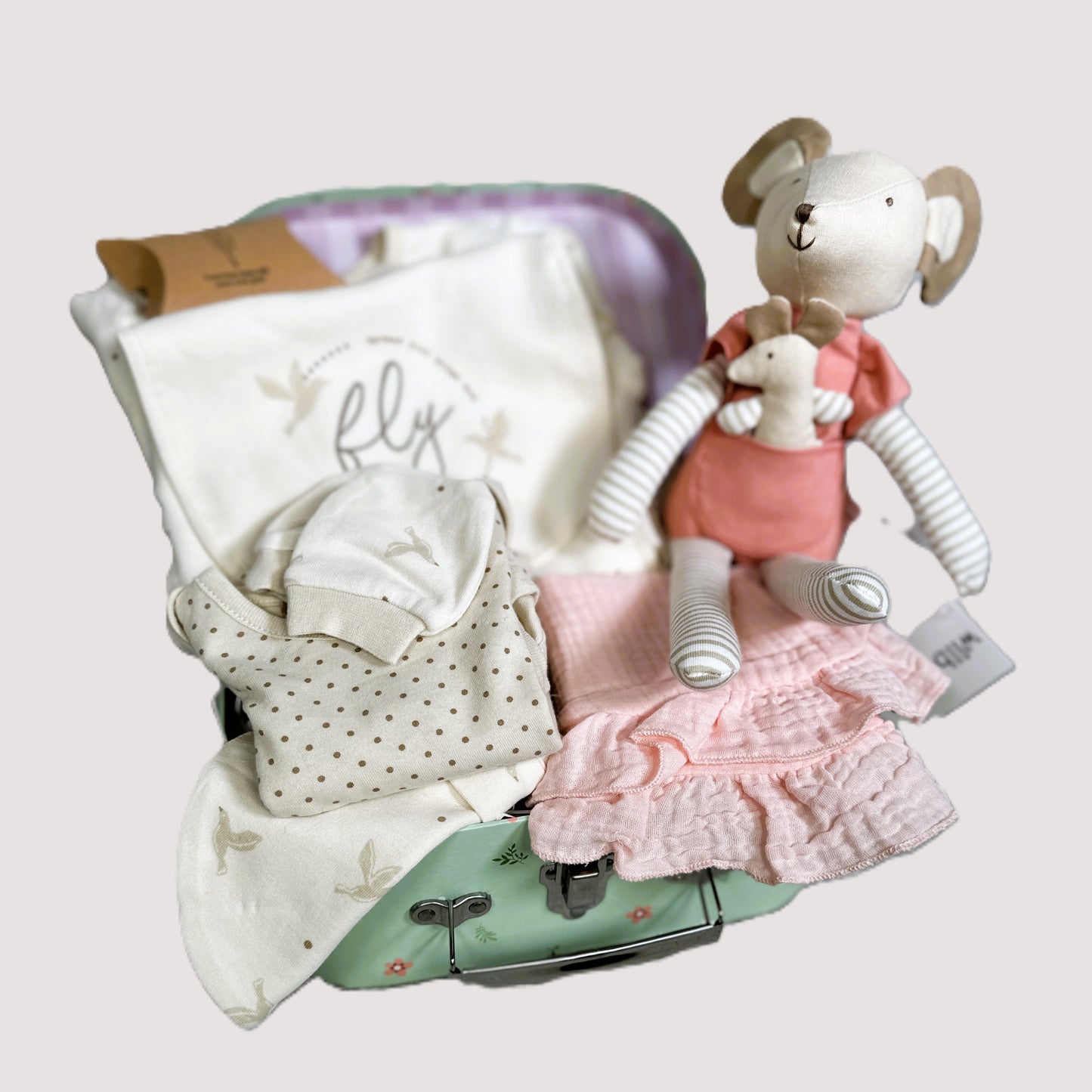 Baby shower gifts, baby clothes, mouse baby toy and bibs in a baby keepsake case.