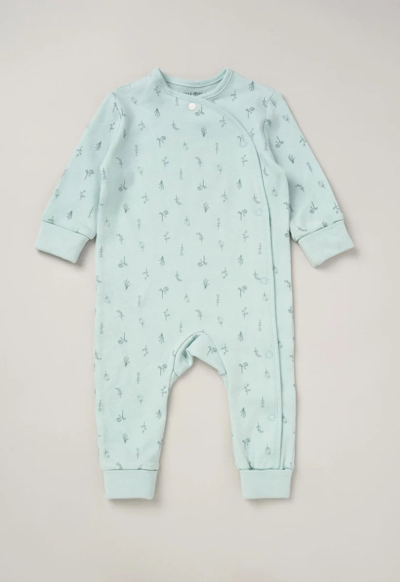 Organic cotton baby sleepsuit in mint green with a pen drawn wildflower motif in a darker green