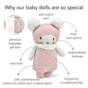 Bella knitted doll with features highlighted on a white background