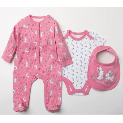 Pink cotton baby gift set of a baby sleepsuit, baby bodysuit and baby dribble bib in a pink and white bunny pattern.