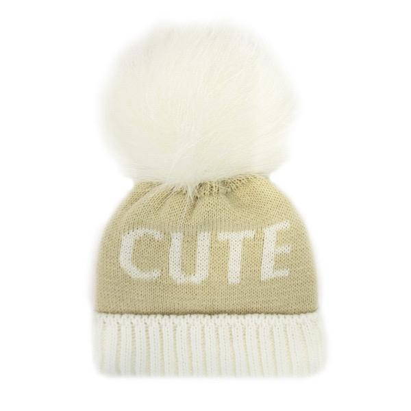 Baby pompom hat in ivory beige with the word "Cute" knitted into it.