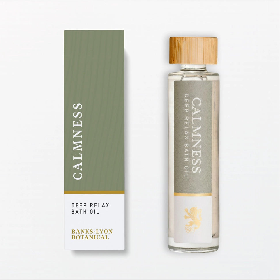 Bottle and box of Calmness Deep Relax Bath Oil on a white background
