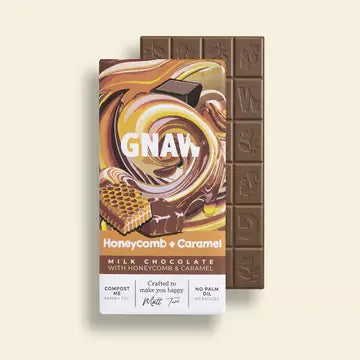 Chocolate bar with packaging labeled 'GNAW Honeycomb + Caramel' on a beige background