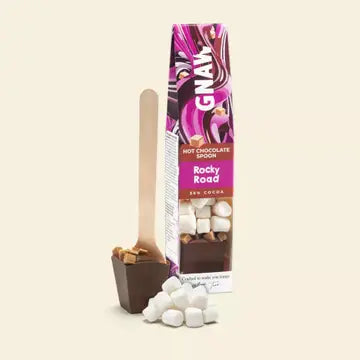 Gnaw Rocky Road hot chocolate spoon packaging with marshmallows on a beige background