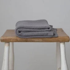 A Grey cotton cellular baby blanket.