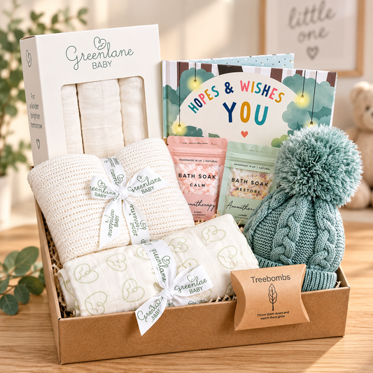 neutral baby hamper with Hopes and wishes hardback baby book, cellular baby blanket, sage green baby pompom hat, muslins and a swaddle blanket