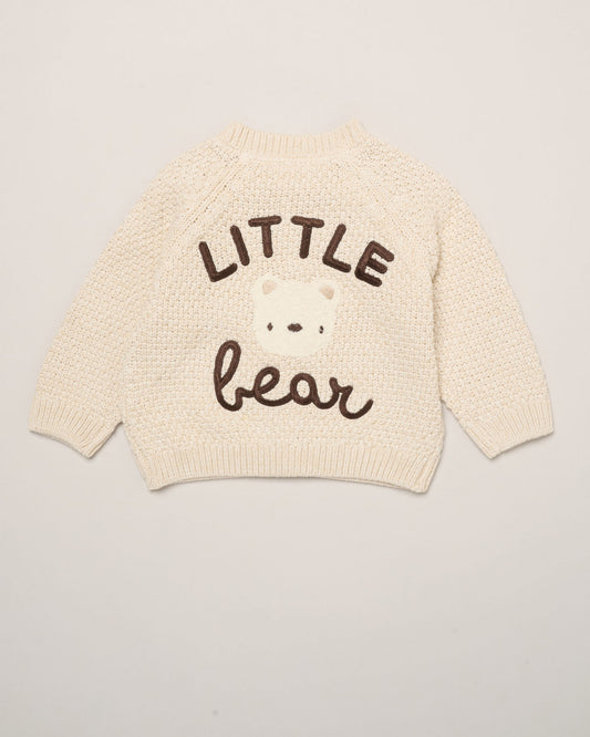 Cream baby cardigan with 'LITTLE bear' text on a light gray background