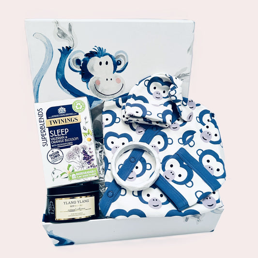 Fabulous new baby gift hamper with a handcrafted baby keepsake box with monkey print, organic cotton GOTS certified monkey print baby romper and matching baby knot hat and treats for the new mummy.