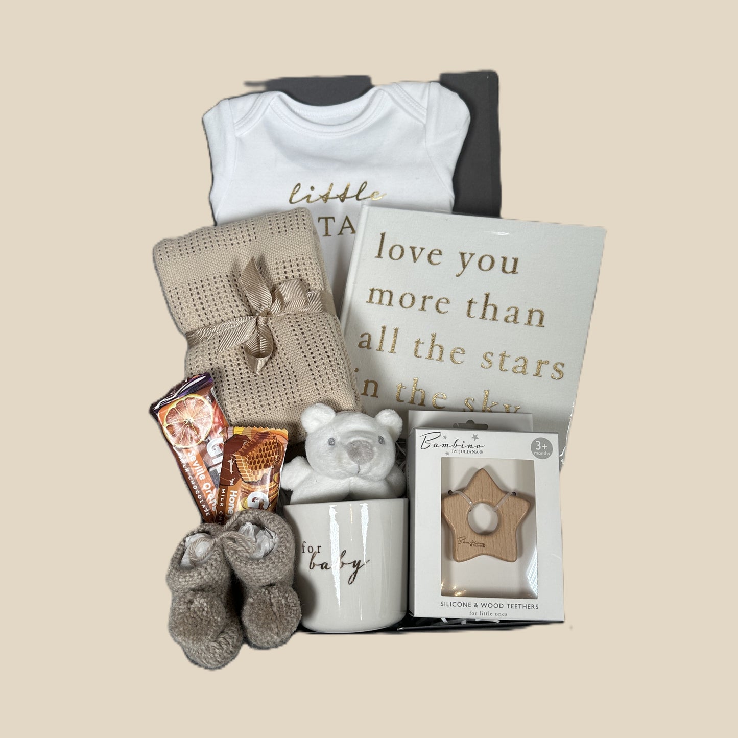 new baby hamper with "little star" baby bodysuit, baby photo album, baby booties and chocolate treats