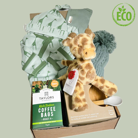 Unisex new Mummy and baby gift hamper with Green organic cotton baby skleep suit with giraffe print and matching bay knot hat, a baby soft toy giraffe, a bamboo baby bowl and spoon weaning set and a green baby pompom hat.