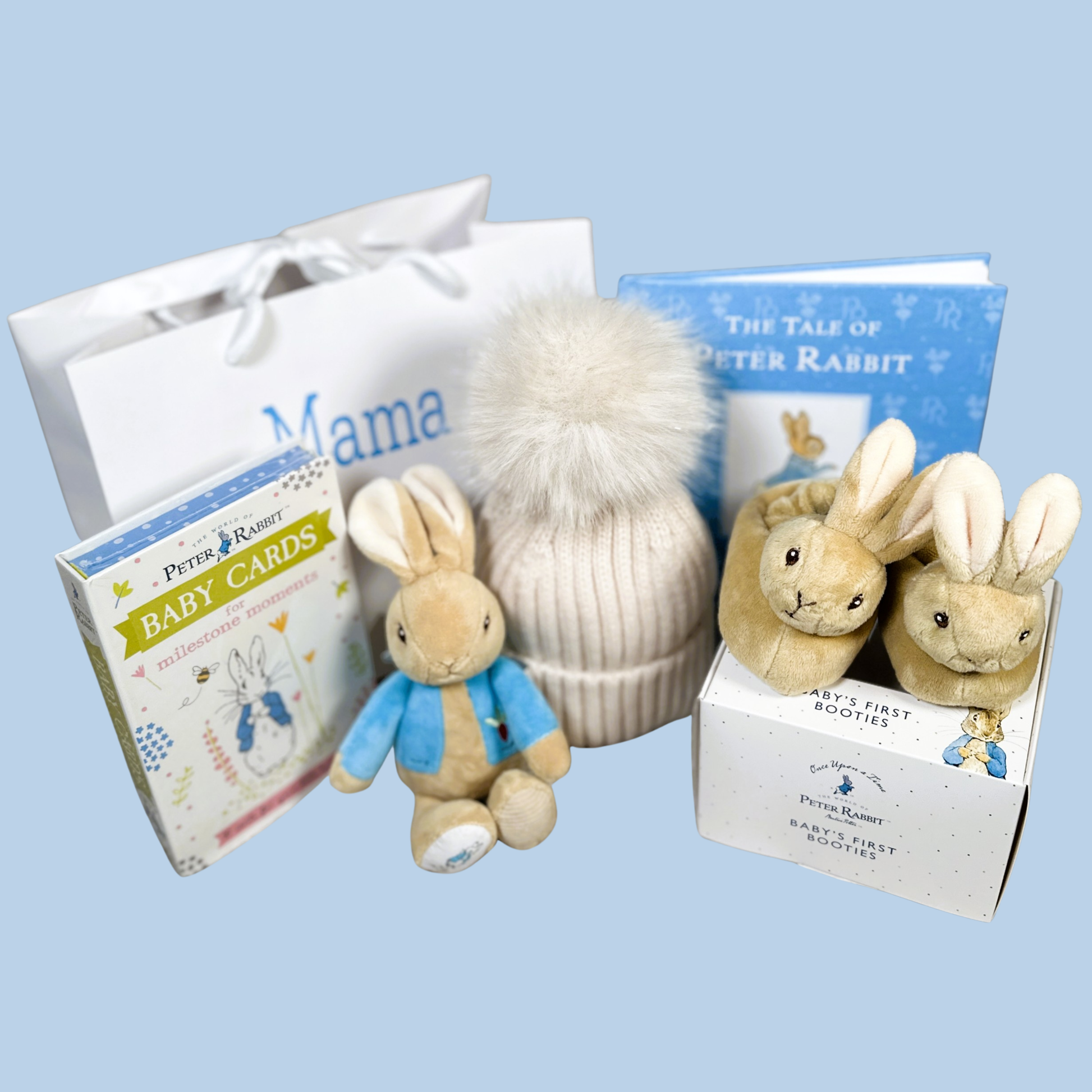 Peter rabbit themed baby hamper with baby rattle and rabbit baby slippers