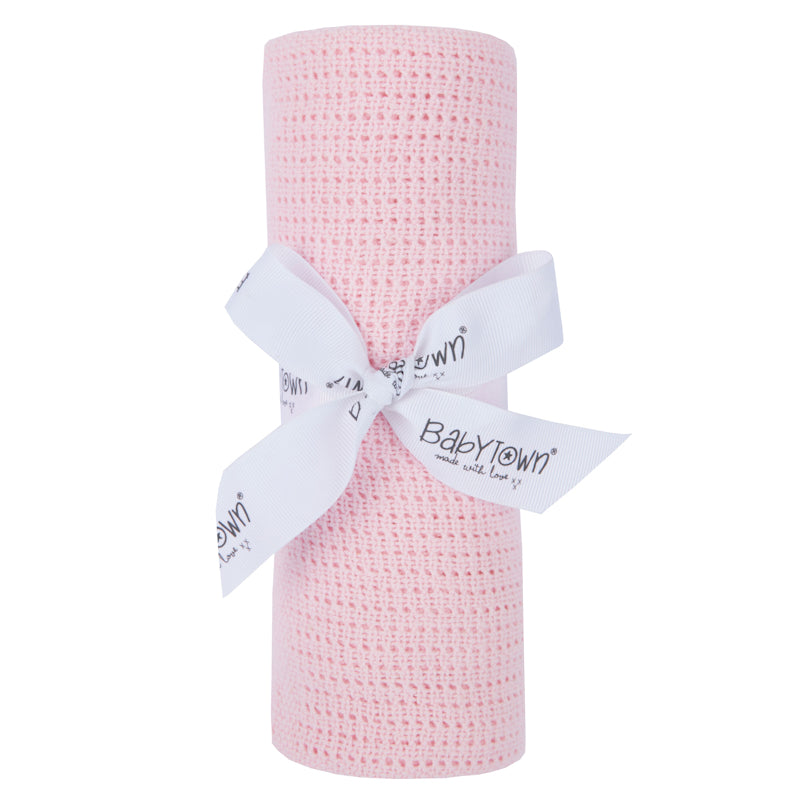 A light pink cellular baby blanket