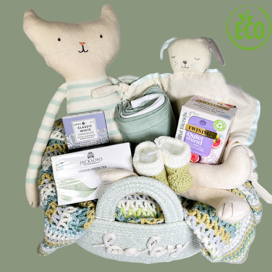 Unisex new baby gift basket full of eco freindly baby soft toys, tea,meriona wool baby booties, a hand crocheted baby blanket and a great rope storgae basket .