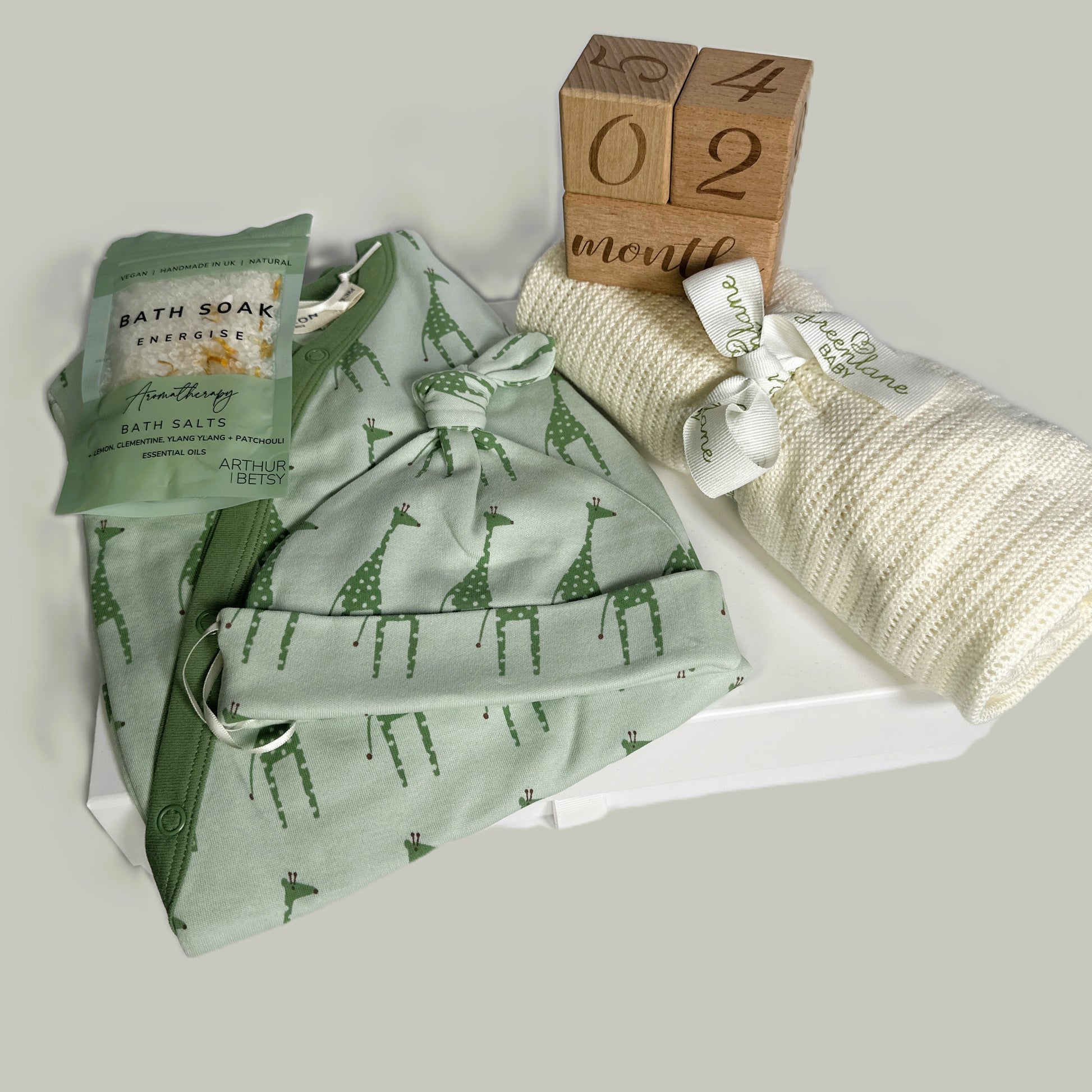 GREEN GIRAFFE PRINT BABY ROMPER AND MATCHING BAY KNOT HAT, BABOO BABY BLANKET, BATH SALT, BABY KEEPSAKE CASE