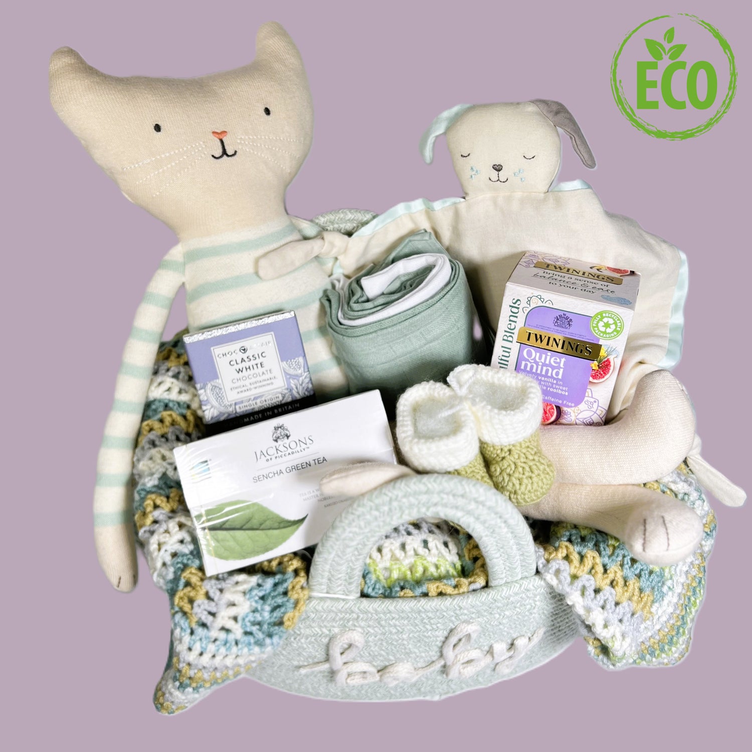 Unisex new baby gift basket full of eco freindly baby soft toys, tea,meriona wool baby booties, a hand crocheted baby blanket and a great rope storgae basket .