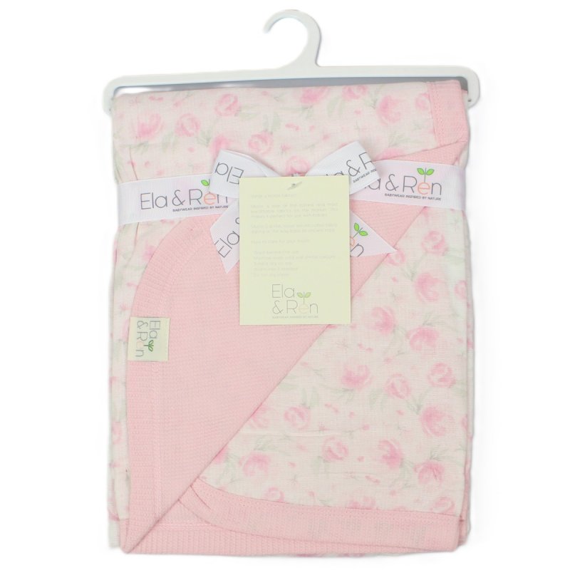 Ela and Ren cotton baby blanket with a rosebud print muslin on one side and a pink cotton waffle on the other.