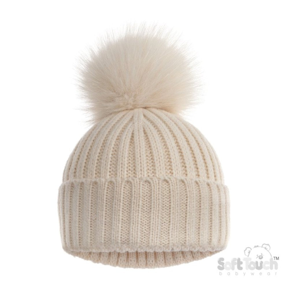 Beige knit beanie with a fluffy pom-pom on a white background.