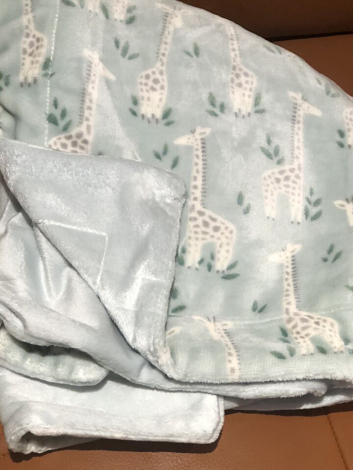 giraffe print baby blanket in mint green and cream