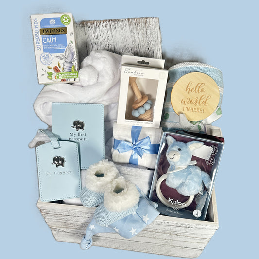 Blue baby boy gift hamper box on a blue background