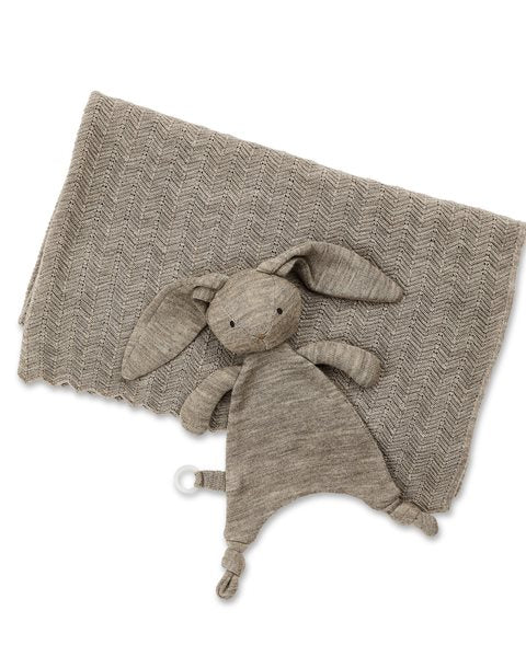 Wool knitted bunny toy on a white background