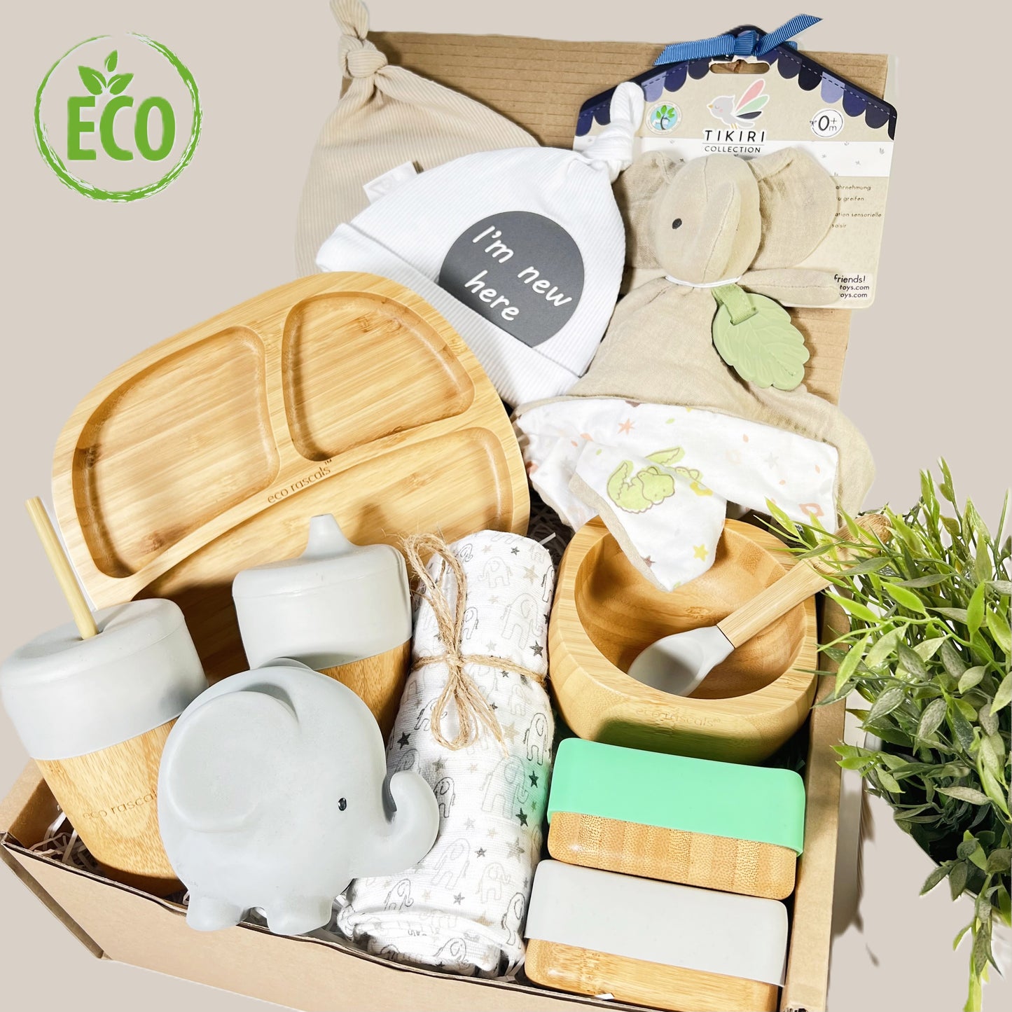 Eco friendly new baby weaning gift containing 6 bamboo baby feeding items, 1 x organic cotton elephant teether comforter, a large cotton muslin square, a natural rubber teething elephant and bath toy, 2 baby knots hats and a baby photography plaque.