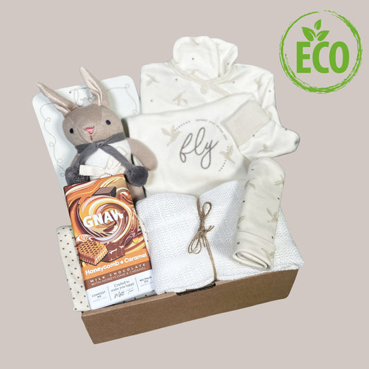 Neutral baby hamper with Gnaw chocolate bar and organic cotton baby rattle and babywear