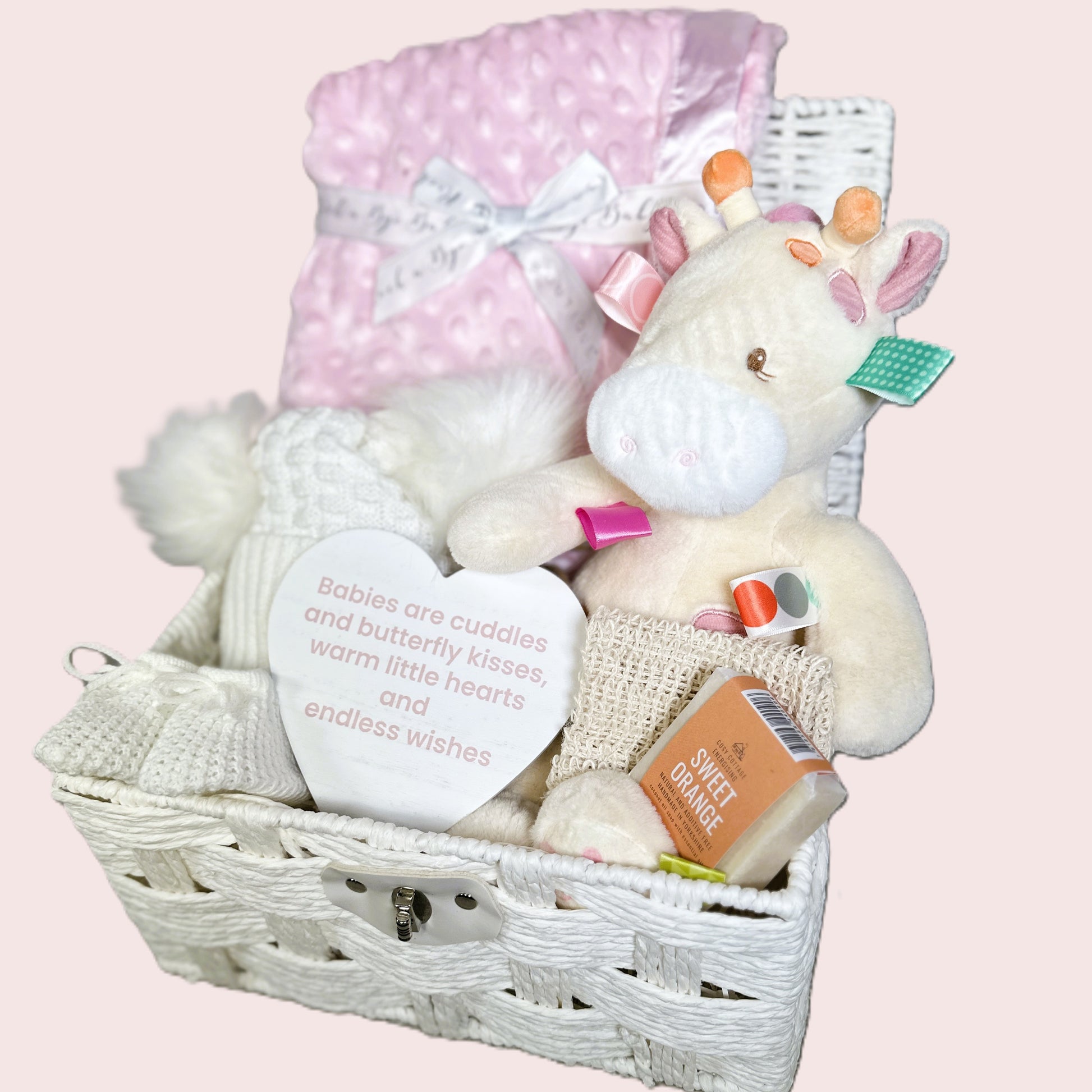 New baby girl hamper with Tilly Taggie giraffe soft baby toy, pink baby blanket and soap