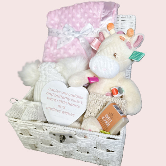 New baby girl hamper with Tilly Taggie giraffe soft baby toy, pink baby blanket and soap