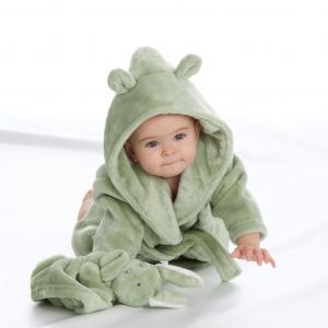 Baby wearing a green  hooded baby dressing gown robe on a white background