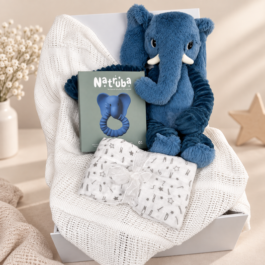 Blue and white baby hamper with natural rubber teether, white cellular baby blanket and an bleu elephant oft toy.