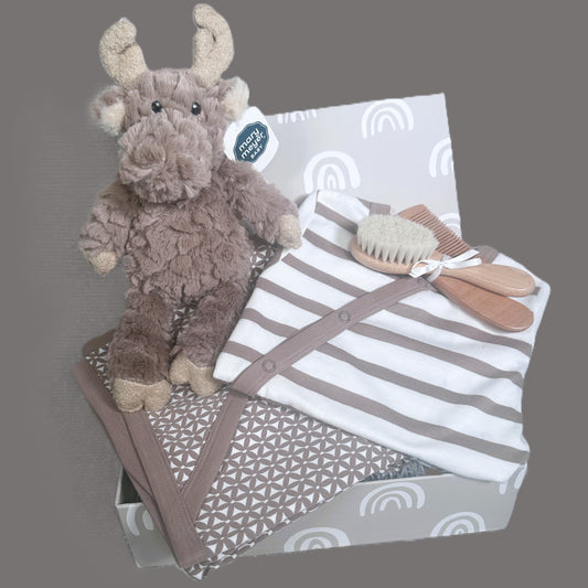 Baby hamper with plush moose toy, blanket, and baby care items on a grey background